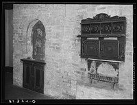 Old oven and shrine in old plantation house near New Orleans, Louisiana by Russell Lee