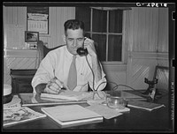 Mr. Schlicher, manager of state rice mill and chairman of National Rice Festival. Crowley, Louisiana by Russell Lee