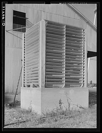 Condensing tower of machinery in cotton gin. Lake Dick Project, Arkansas by Russell Lee