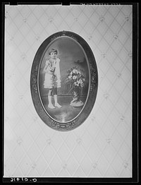 Daughter of Joseph La Blanc, pictured in First Communion dress. Crowley, Louisiana by Russell Lee