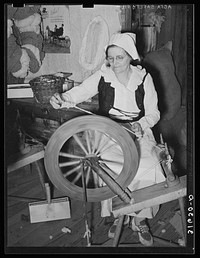 Madame Dronet spinning thread from carded cotton. Erath, Louisiana by Russell Lee