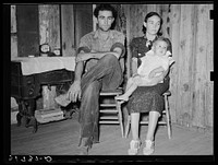 Son of W.E. Smith with wife and child who are to receive aid from FSA (Farm Security Administration). Near Morganza, Louisiana by Russell Lee