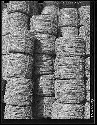 Piles of barbed wire near New Roads, Louisiana by Russell Lee