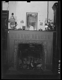 Fireplace in Acadian home near Breaux Bridge, Louisiana by Russell Lee