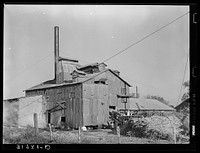 Sugar mill near Breaux Bridge, Louisiana by Russell Lee