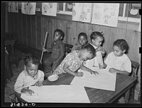 Children playing with chalk in nursery school. Lakeview Project, Arkansas by Russell Lee