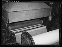 Saturating cotton thread with sweet potato starch at cotton mill. Laurel, Mississippi by Russell Lee