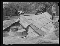 Underground storage cellar in Mexican section. San Antonio, Texas. This was used for household and personal equipment for which there was no room in the house by Russell Lee