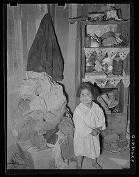 Mexican child in corner of living room. San Antonio, Texas by Russell Lee