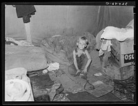 White migrant child in tent at Corpus Christi, Texas by Russell Lee