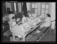 Mexican pecan shellers removing nuts from shells, non-union plant. San Antonio, Texas by Russell Lee