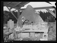 Oven of Italian strawberry grower near Independence, Louisiana. The Italians in this section all have these outdoor ovens and bake all their bread in them by Russell Lee