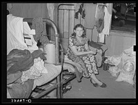 Member of migrant family group while they were camping near Muskogee, Oklahoma doing day labor to obtain funds to go to California by Russell Lee