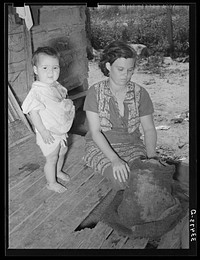 Wife and child of tenant farmer living near Warner, Oklahoma by Russell Lee