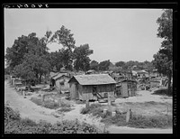 Part of Mays Avenue camp. Oklahoma City, Oklahoma. Notice water boilers which form decoration and fence. See general caption no. 21 by Russell Lee