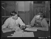 FSA (Farm Security Administration) supervisor conferring with client about farm plan. Sheridan County, Kansas by Russell Lee