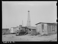 Homes of oil field workers. Oklahoma City, Oklahoma. During periods of unemployment laundry work is done by Russell Lee