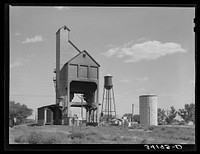 Coaling station for locomotives on the railroad at Syracuse, Kansas by Russell Lee
