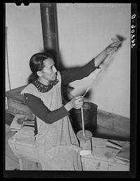 Spanish-American woman spinning woolen thread at WPA (Works Progress Administration/Work Projects Administration) project. Costilla, New Mexico by Russell Lee