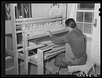 Weaving rag rug at WPA (Works Progress Administrrtion/Work Projects Administration) project. Costilla, New Mexico by Russell Lee