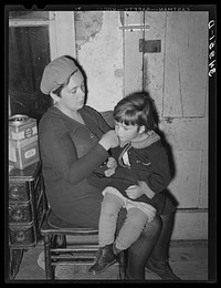 [Untitled photo, possibly related to: Wife of FSA (Farm Security Administration) client fixing her daughter's hair. Farm near Bradford, Vermont, Orange County] by Russell Lee