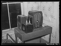 Battery-operated radio in farm home of FSA (Farm Security Administration) client in Orange County near Bradford, Vermont by Russell Lee
