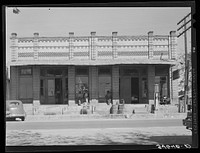 [Untitled photo, possibly related to: Post office and business establishments on the main street of Waelder, Texas] by Russell Lee