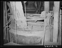 Gears and all machinery in a cotton seed oil mill are covered with a fine dust. Cotton seed oil mill. McLennan County, Texas by Russell Lee