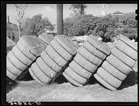 Bales of cotton in gin yard. West, Texas by Russell Lee