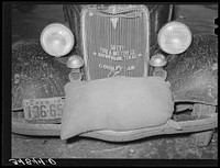 Sack of feed on bumper of automobile. Brownwood, Texas by Russell Lee
