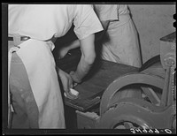 [Untitled photo, possibly related to: Preparing rolls for baking. Bakery, San Angelo, Texas] by Russell Lee