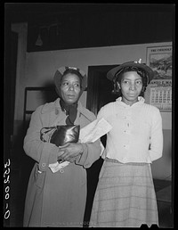 [Untitled photo, possibly related to: Wife of Pomp Hall, right, talking with another woman at UCAPAWA (United Cannery, Agricultural, Packing, and Allied Workers of America) meeting at Bristow, Oklahoma. See general caption number 23] by Russell Lee