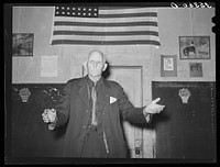 Colonel Lilly, auctioneer at pie supper. McIntosh County, Oklahoma. See general caption number 24 by Russell Lee