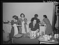 Wives of the Jaycees washing and drying dishes after supper in high school. Eufaula, Oklahoma. See general caption number 25 by Russell Lee