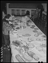 Wife of Jaycee member bringing food to the buffet supper at the high school. Eufaula, Oklahoma. See general caption number 25 by Russell Lee