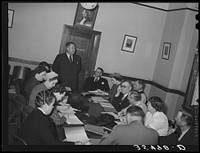 FSA (Farm Security Administration) regional official talking to a group of FSA officials and supervisors at a district meeting at San Angelo, Texas by Russell Lee