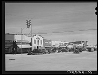 Main street in the oil boom town of Hobbs, New Mexico by Russell Lee