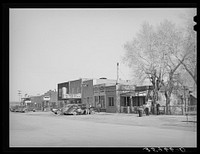 Main street in Springerville, Arizona. Springerville is the center of good ranching area where flood irrigation is used to cultivate hay crops by Russell Lee