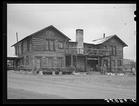 Navajo Lodge, Datil, New Mexico. This was an old ranch house in the mountains. About thirty years ago the rancher who owned it had it dismantled and moved it piece by piece and rebuilt it at its present location. He is now dead and the house is used as a hotel principally for summer visitors by Russell Lee