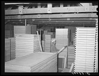 Mill work doors and windows at the warehouse of the United Producers and Consumers Cooperative. Phoenix, Arizona by Russell Lee