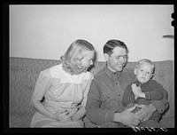 Member of the Arizona part-time farms with his wife and child. Maricopa County, Arizona. Chandler Unit by Russell Lee