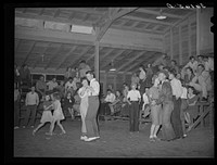 Saturday night dance in the community building of the Agua Fria migratory labor camp. Arizona by Russell Lee