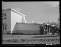 Detail of corner of apartment house and garage at Arizona part-time farms. Chandler Unit, Maricopa County, Arizona by Russell Lee