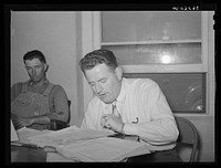 FSA (Farm Security Administration) official reporting expenditures of the Casa Grande Valley Farms, Pinal County, Arizona, at a board meeting by Russell Lee