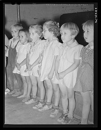 Children singing at the nursery school of the Casa Grande Valley Farms. Pinal County, Arizona by Russell Lee