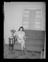 Wife of member of the Casa Grande Valley Farms, Pinal County, Arizona, in her living room by Russell Lee