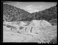 Tailings at abandoned copper mine at Leopold, New Mexico by Russell Lee