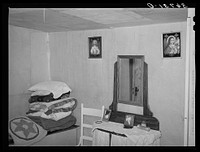 Guest room on the farm of George Hutton. Pie Town, New Mexico by Russell Lee