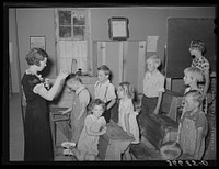 [Untitled photo, possibly related to: The school day opens with prayer at private school at the Farm Bureau building. Pie Town, New Mexico] by Russell Lee