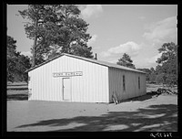 Farm Bureau building. Pie Town, New Mexico. The lumber for the building was placed on the grounds by Mr. Craig three years ago. The farmers got nothing and did the work by Russell Lee